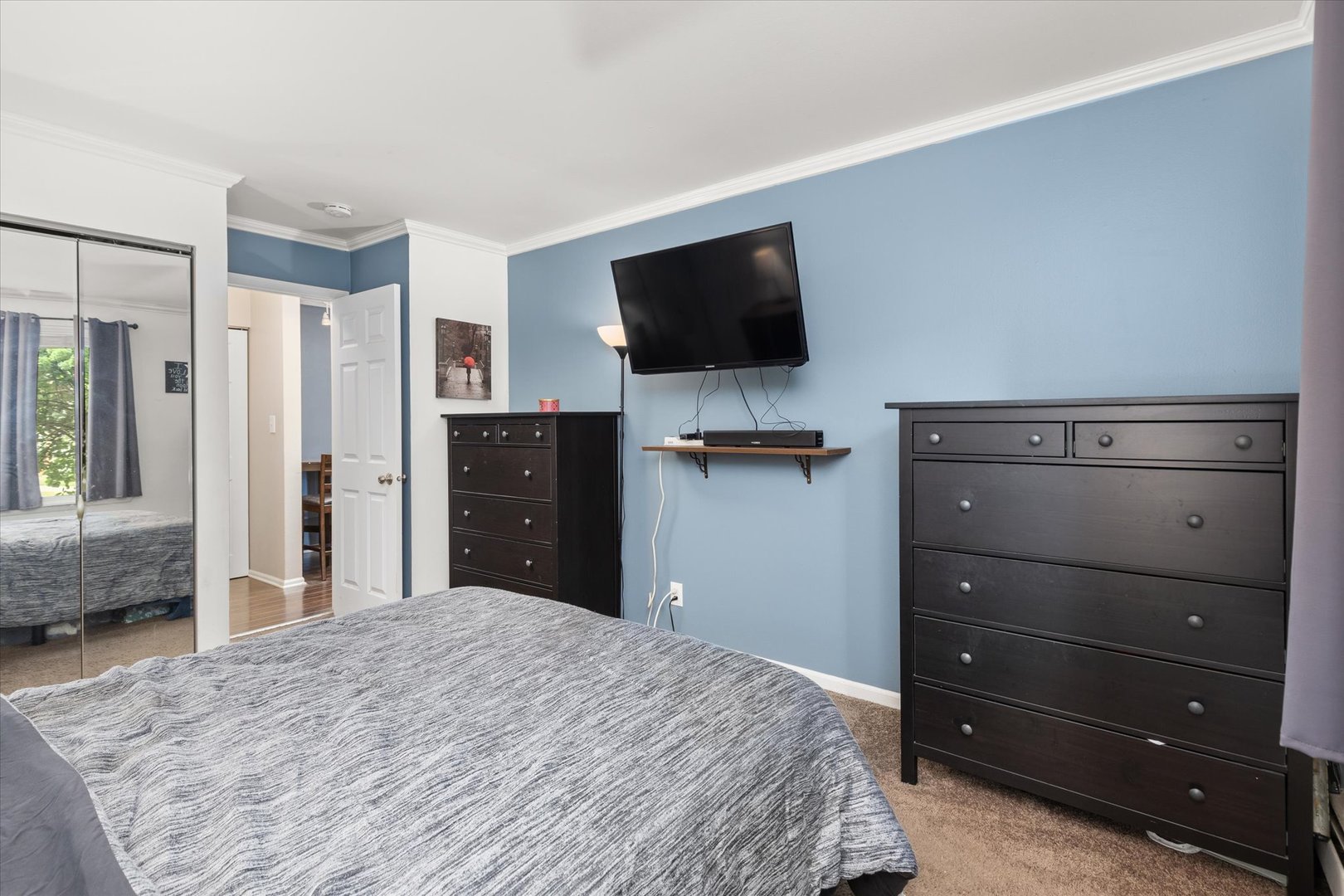 2400 Light Road, Unit 111 Oswego, IL 60543 - Photo 13 of 27 a bedroom with a bed and a flat screen tv