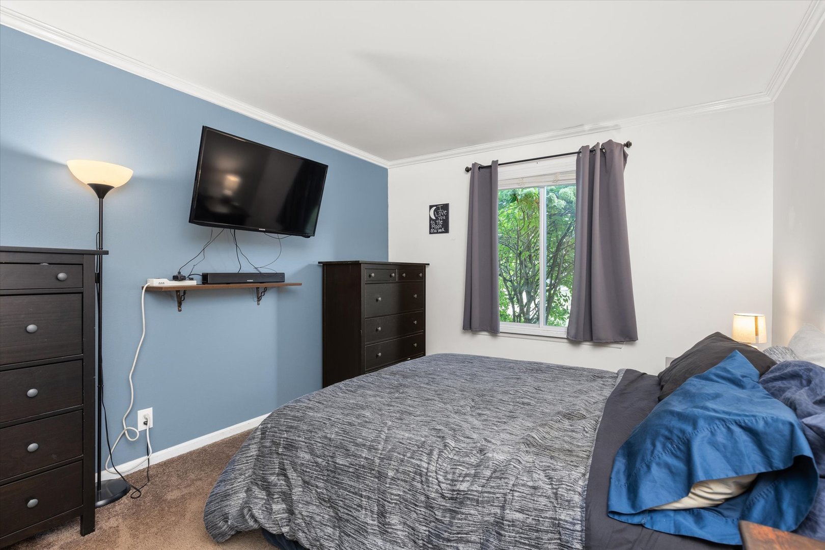 2400 Light Road, Unit 111 Oswego, IL 60543 - Photo 14 of 27 a bedroom with a bed and a flat screen tv