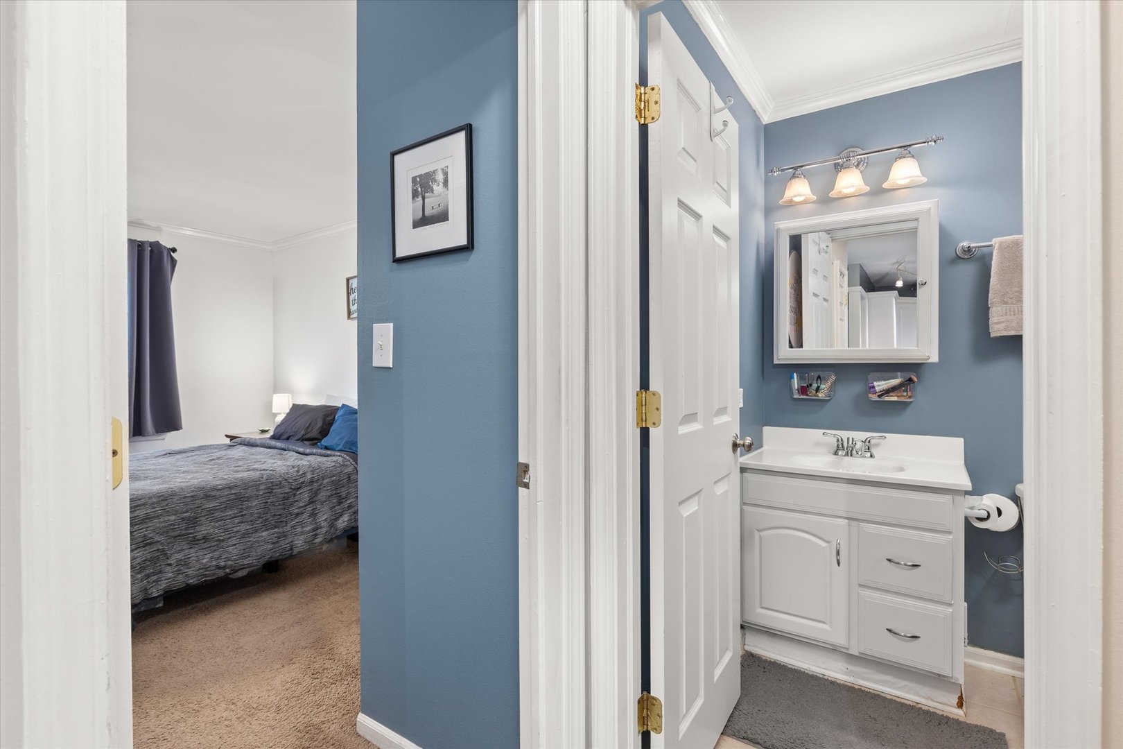 2400 Light Road, Unit 111 Oswego, IL 60543 - Photo 15 of 27 a en suite bathroom with a sink and a mirror