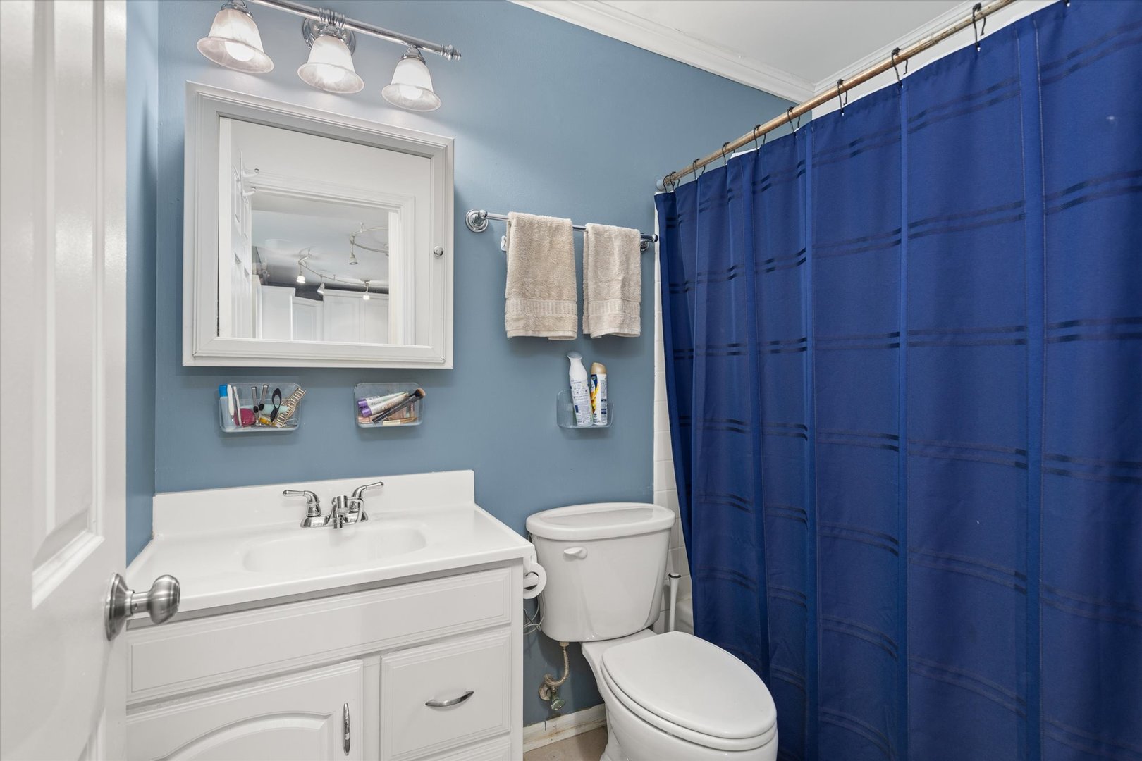 2400 Light Road, Unit 111 Oswego, IL 60543 - Photo 16 of 27 a bathroom with a sink a toilet and vanity