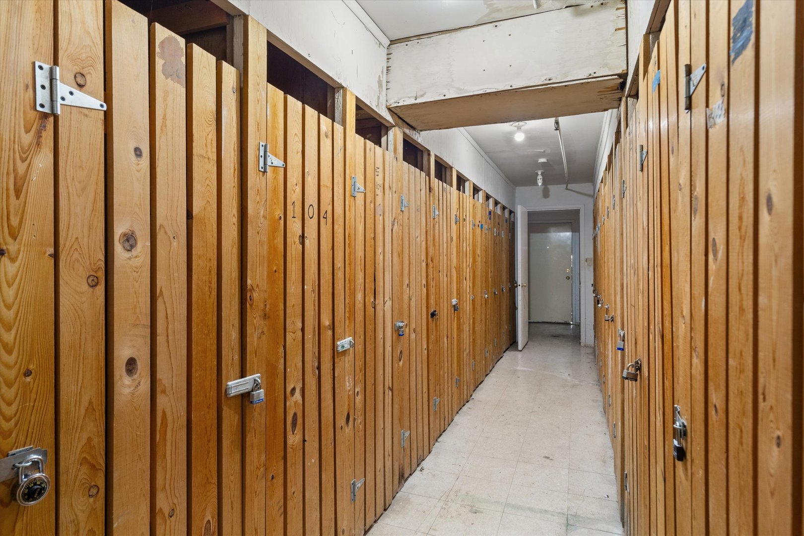 2400 Light Road, Unit 111 Oswego, IL 60543 - Photo 26 of 27 a view of a hallway with wooden walls