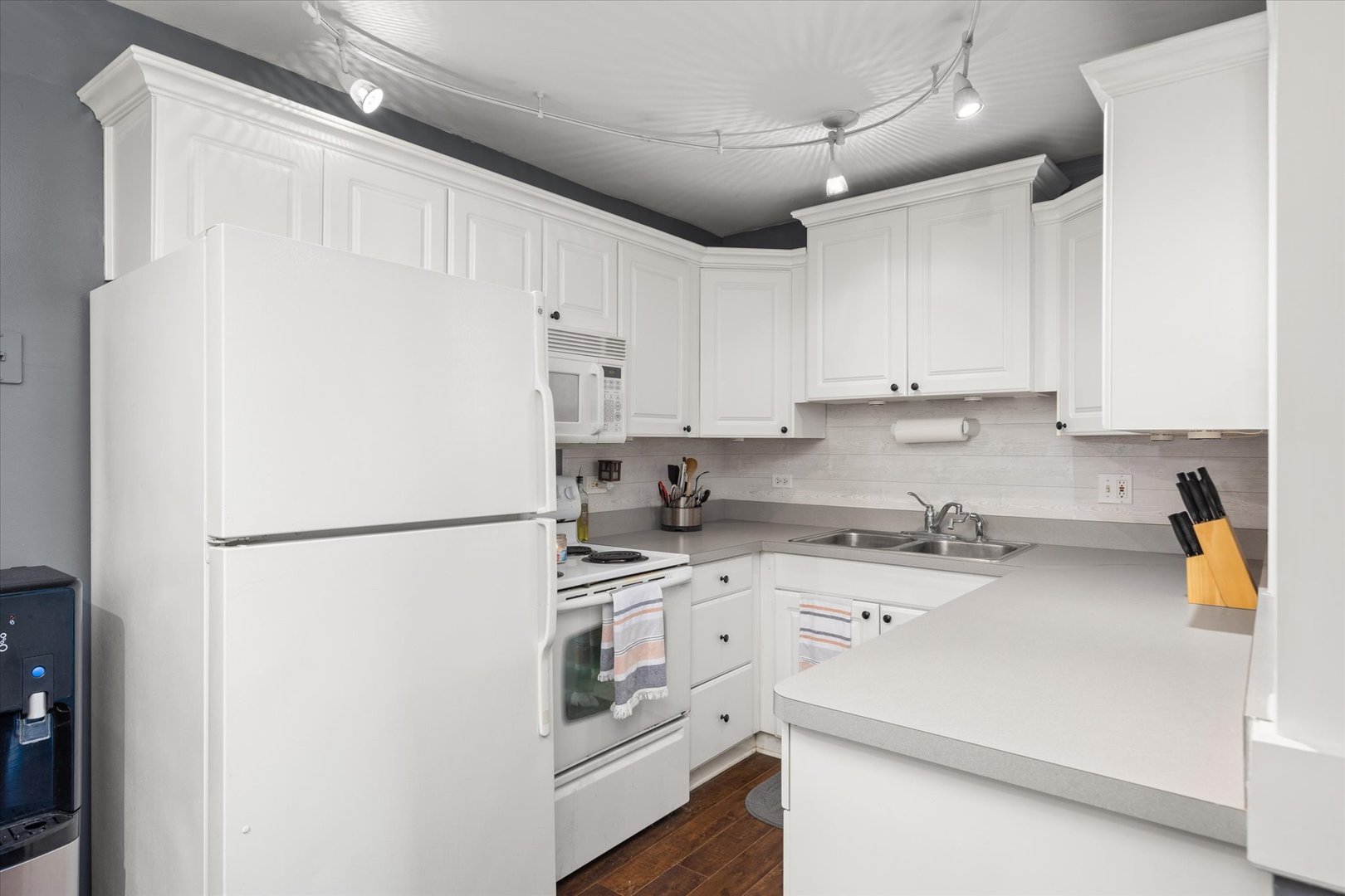 2400 Light Road, Unit 111 Oswego, IL 60543 - Photo 7 of 27 a white refrigerator freezer sitting in a kitchen