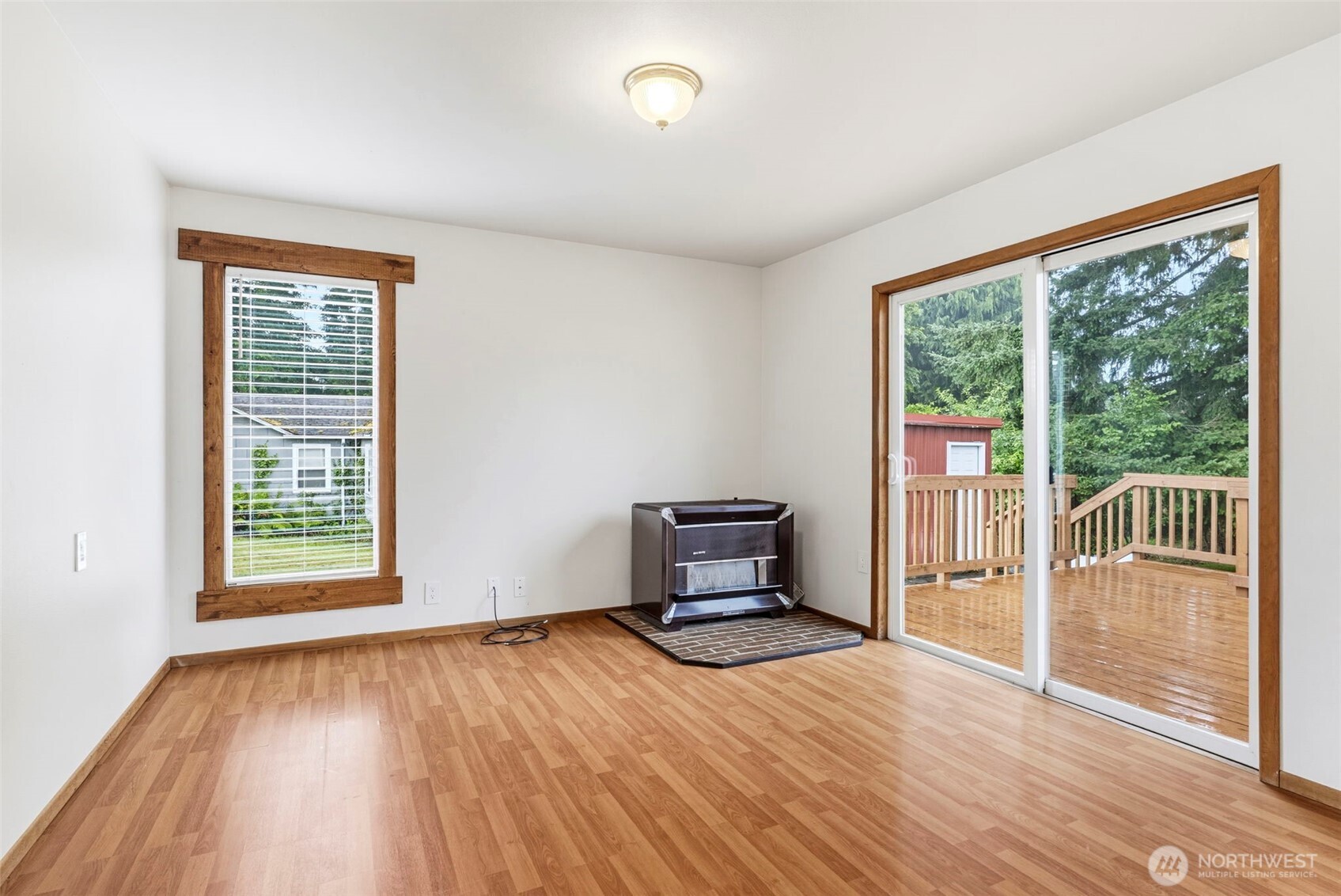 175 Jacobson Road Cathlamet, WA 98612 - Photo 17 of 32 an empty room with wooden floor and windows