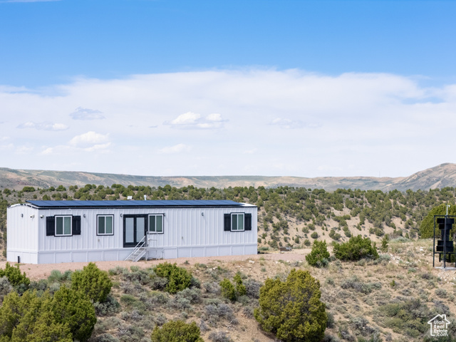 900 Altamont Road Evanston, WY 82930 - Photo 2 of 27 View of front facade featuring a mountain view