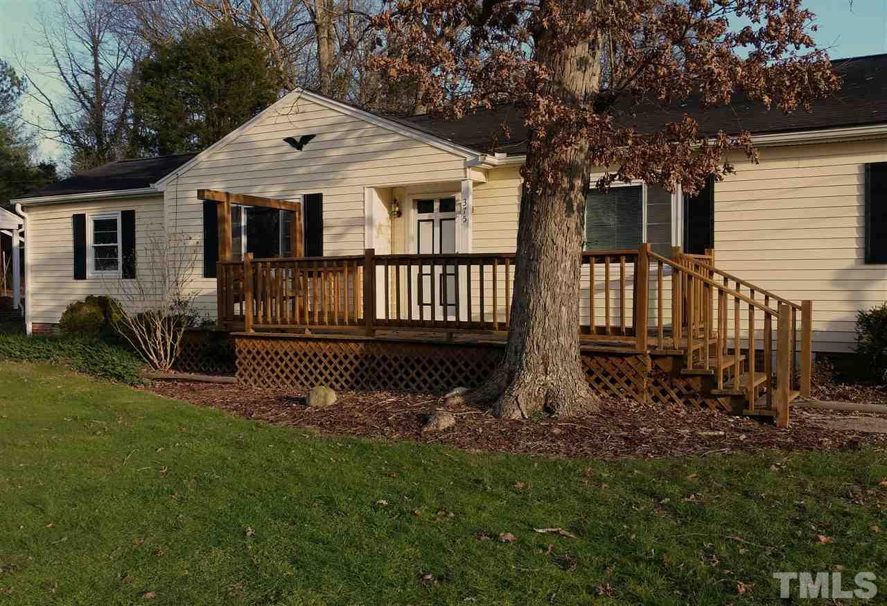 375 Burlington Road Roxboro, NC 27573 - Photo 2 of 11 a view of a house with a yard and a garden
