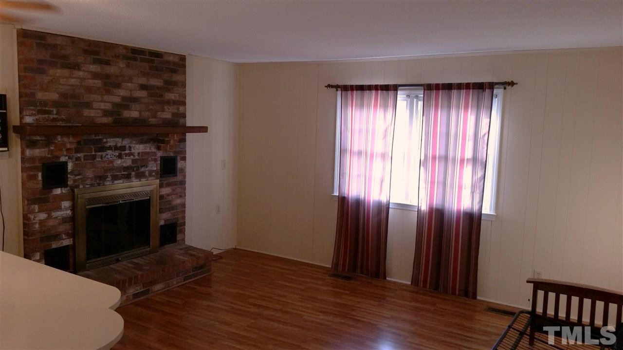 375 Burlington Road Roxboro, NC 27573 - Photo 5 of 11 a view of a livingroom with a fireplace
