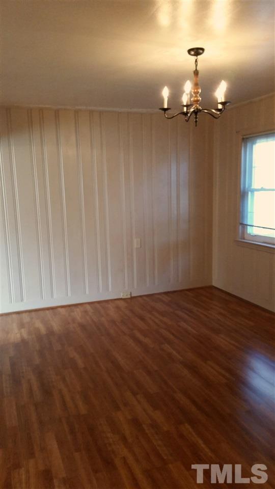375 Burlington Road Roxboro, NC 27573 - Photo 6 of 11 wooden floor in an empty room with a window