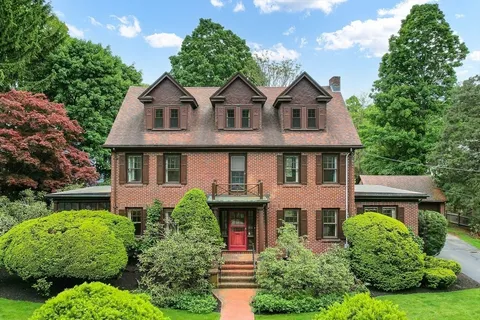 front view of a house with a yard