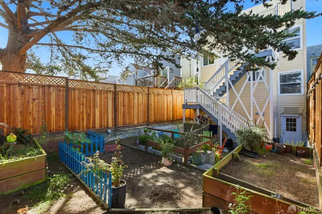a view of a porch with wooden floor and fence