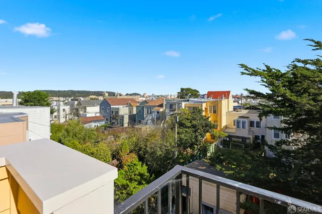 a view of a street from a balcony
