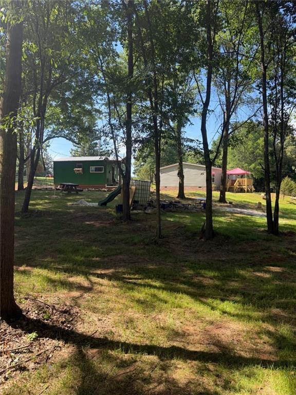 2606 Whipporwill Road Royston, GA 30662 - Photo 21 of 30 a view of a yard with swimming pool