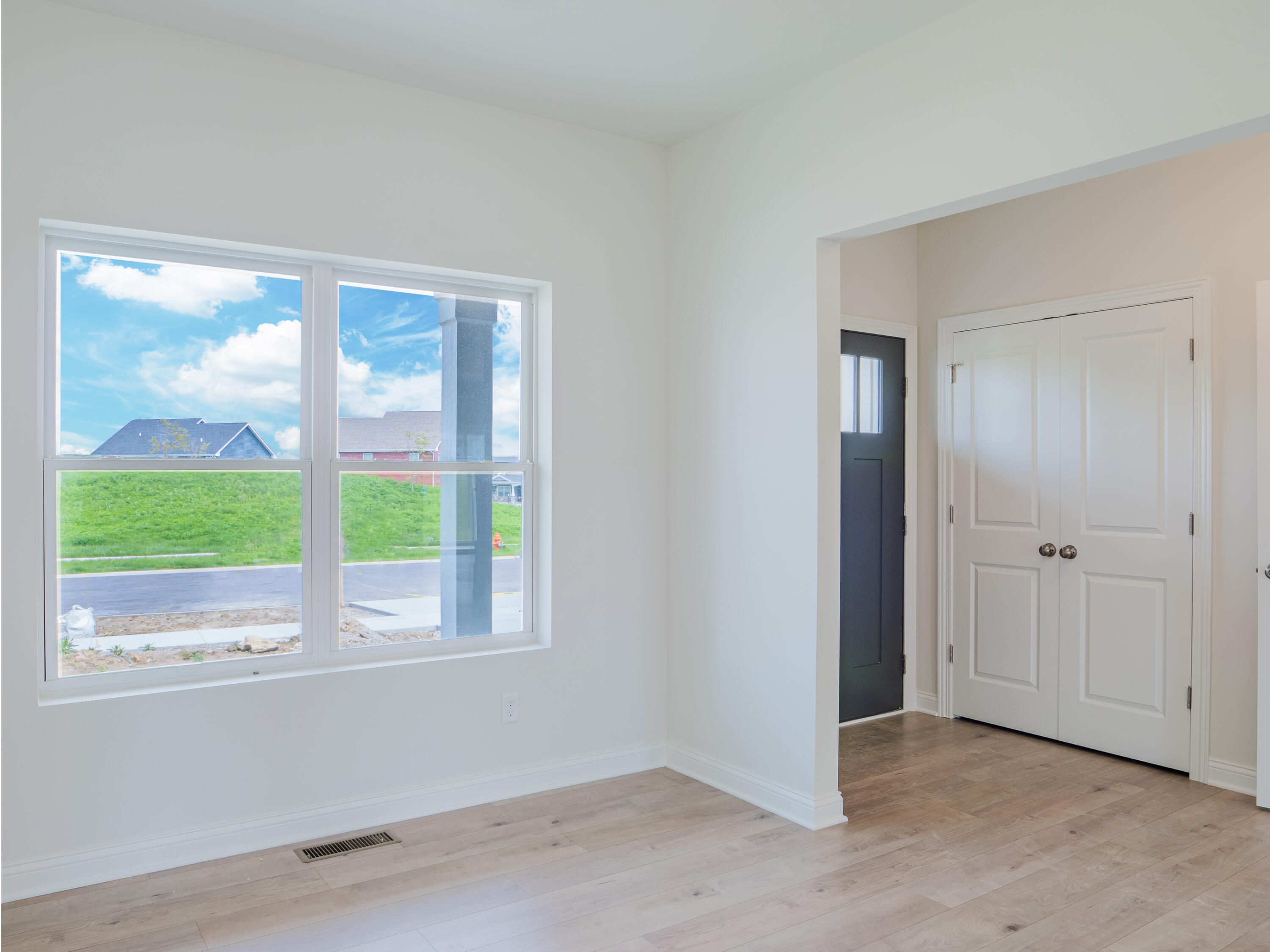 11659 Park Street Crown Point, IN 46307 - Photo 3 of 24 a view of an empty room with a window