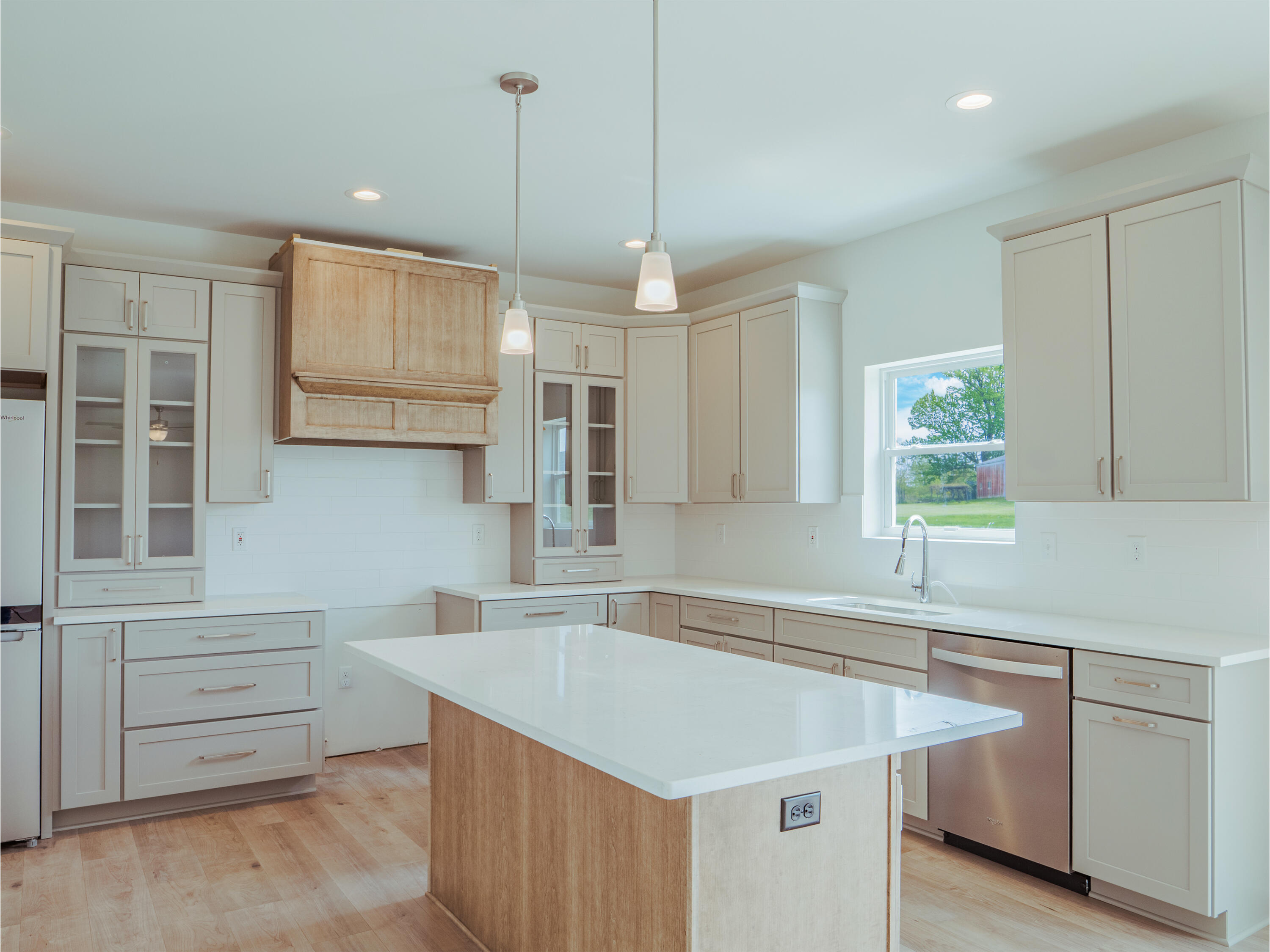 11659 Park Street Crown Point, IN 46307 - Photo 7 of 24 a kitchen that has a sink a window and stainless steel appliances