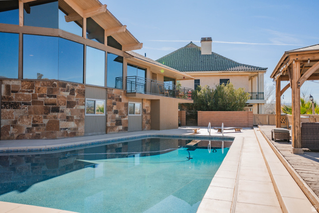 980 Cactus Circle St. George, UT 84790 - Photo 61 of 77 View of pool with patio surround and a balcony