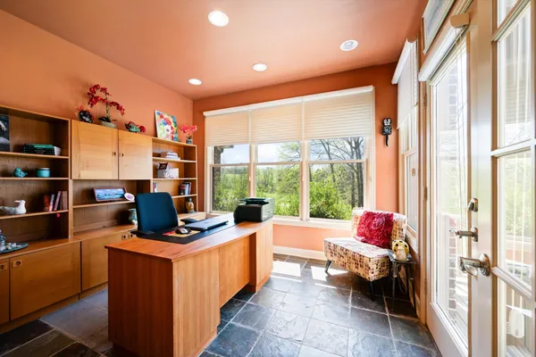 a very nice looking room with a large window and a couch