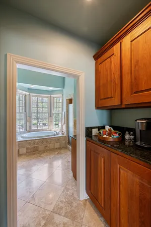 a kitchen with a stove a sink and a cabinets