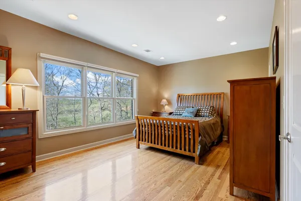 a bedroom with furniture and a window