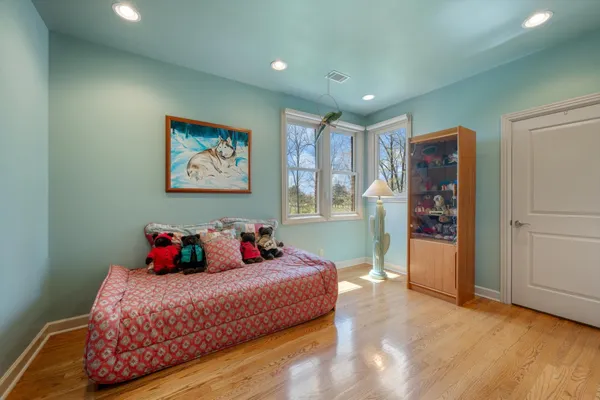 a bedroom with a bed and furniture