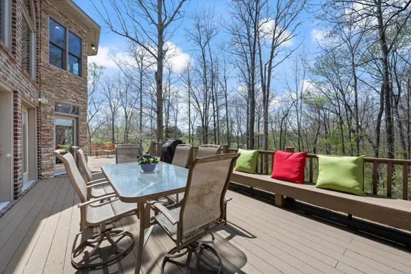 a view of a chairs and tables on the deck
