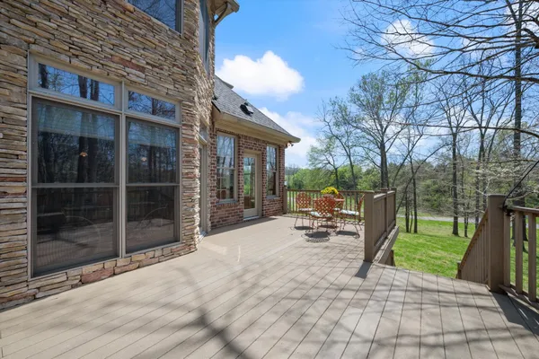 a view of a backyard with a patio and garden