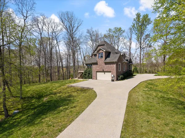 an aerial view of a house with yard
