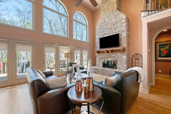 a living room with fireplace furniture and a flat screen tv