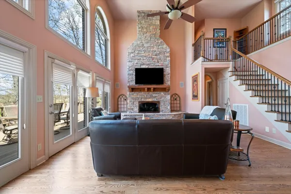 a living room with fireplace furniture and a flat screen tv