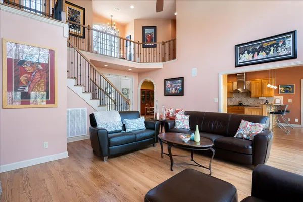 a living room with furniture and a painting