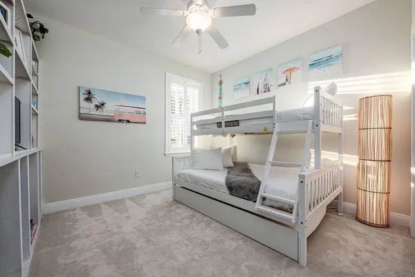 a bed room with a bed and a chandelier