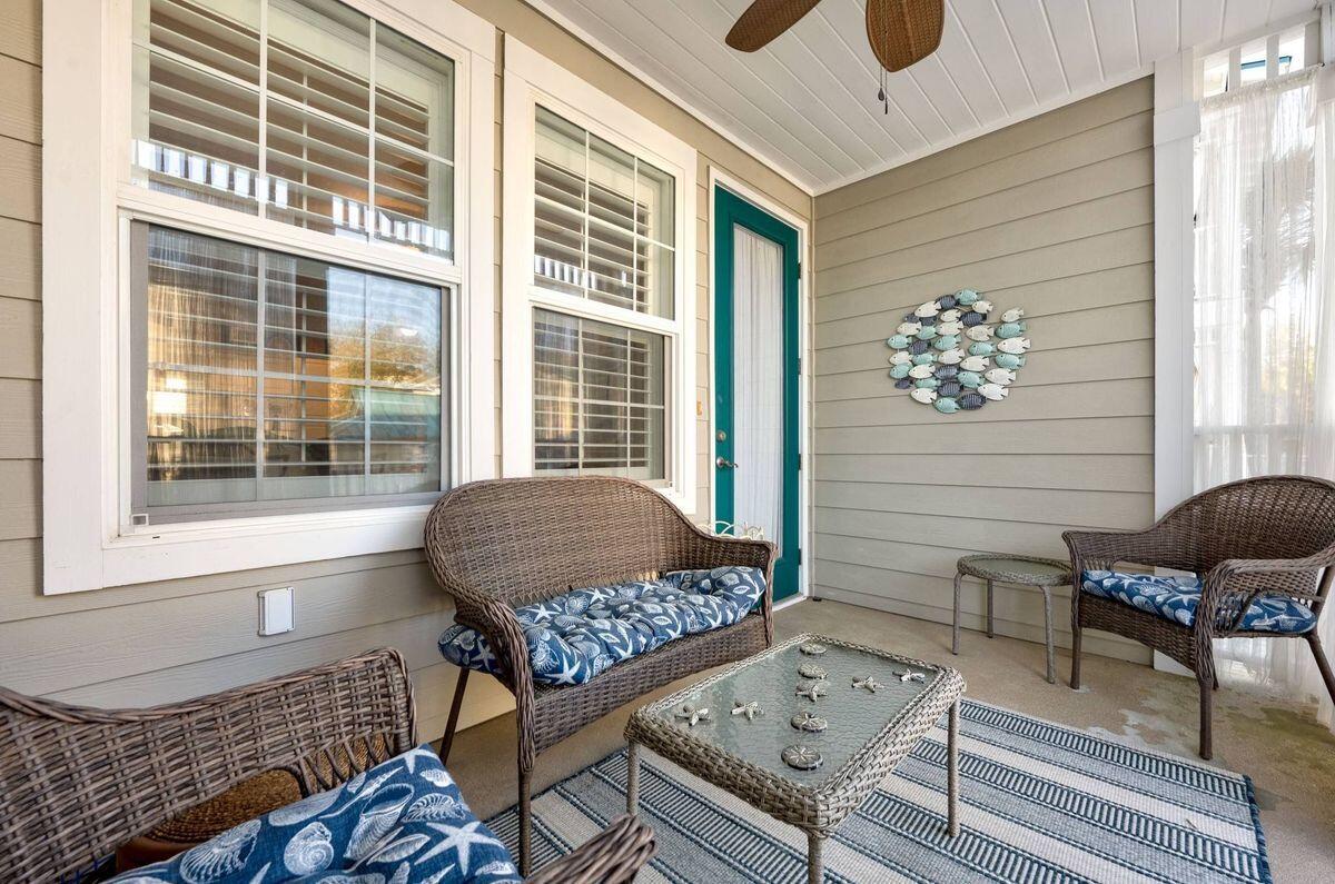 124 Village Boulevard, Unit 813 Santa Rosa Beach, FL 32459 - Photo 13 of 19 a living room with a couch and a table