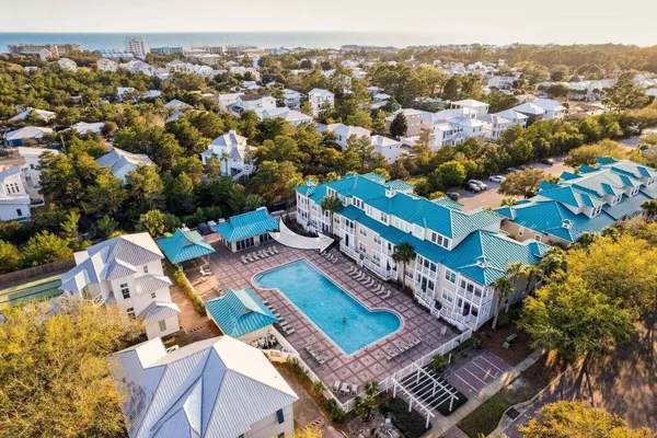 an aerial view of a house with a ocean view
