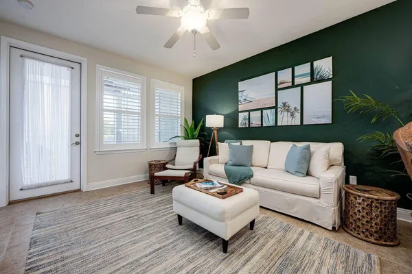 a living room with furniture and a large window