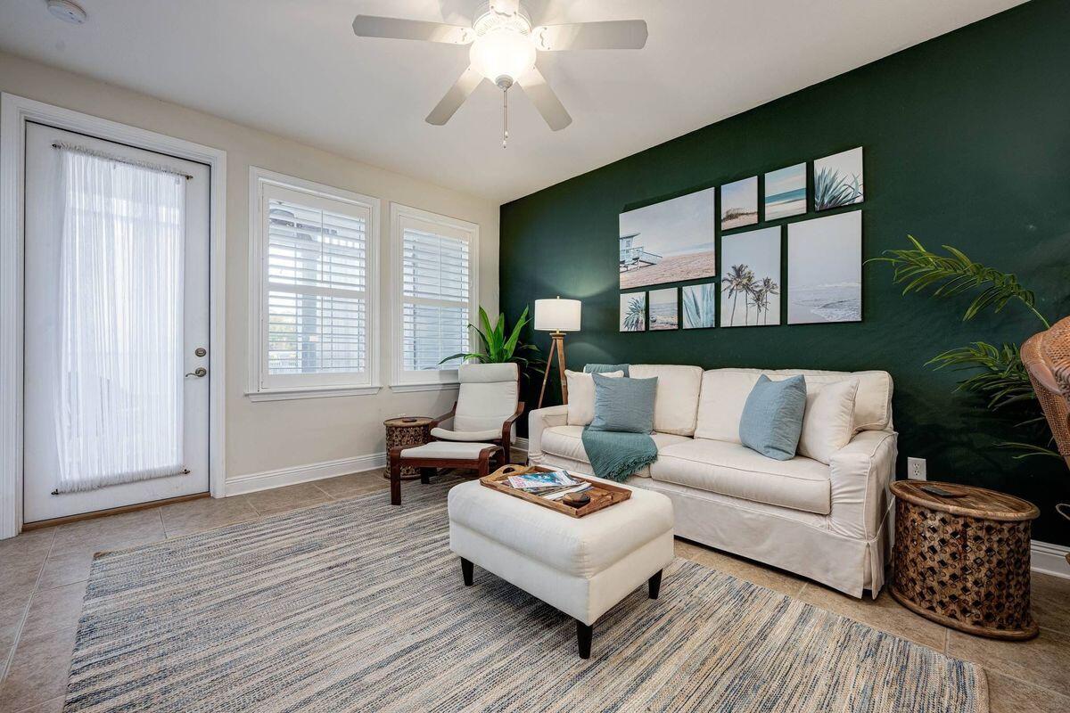 124 Village Boulevard, Unit 813 Santa Rosa Beach, FL 32459 - Photo 3 of 19 a living room with furniture and a large window
