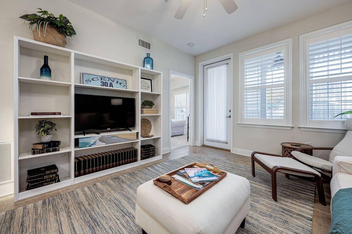 124 Village Boulevard, Unit 813 Santa Rosa Beach, FL 32459 - Photo 4 of 19 a living room with furniture and a flat screen tv