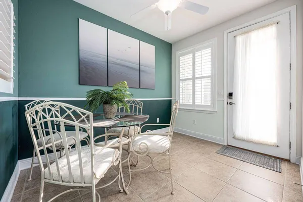 a dining room with furniture and window