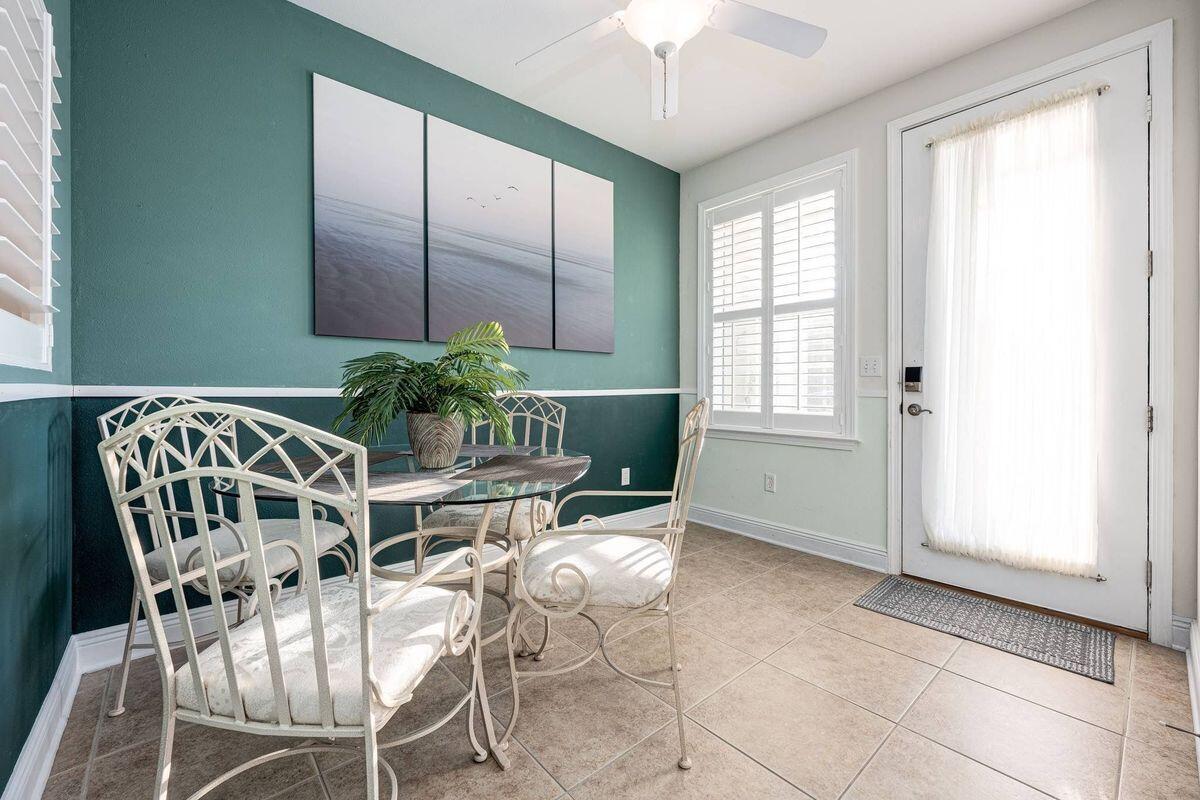 124 Village Boulevard, Unit 813 Santa Rosa Beach, FL 32459 - Photo 8 of 19 a dining room with furniture and window