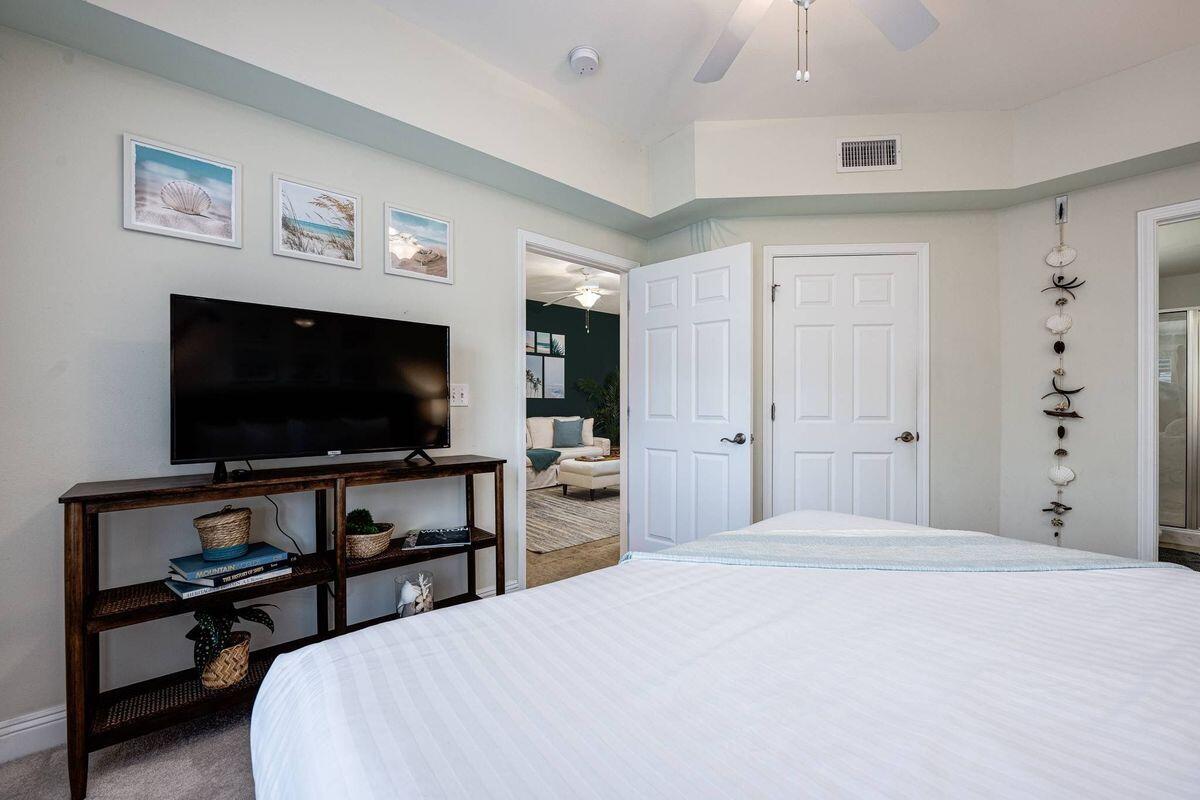 124 Village Boulevard, Unit 813 Santa Rosa Beach, FL 32459 - Photo 10 of 19 a bedroom with a bed and a flat screen tv