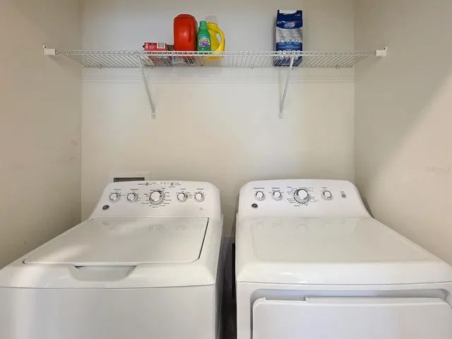 a utility room with dryer and washer