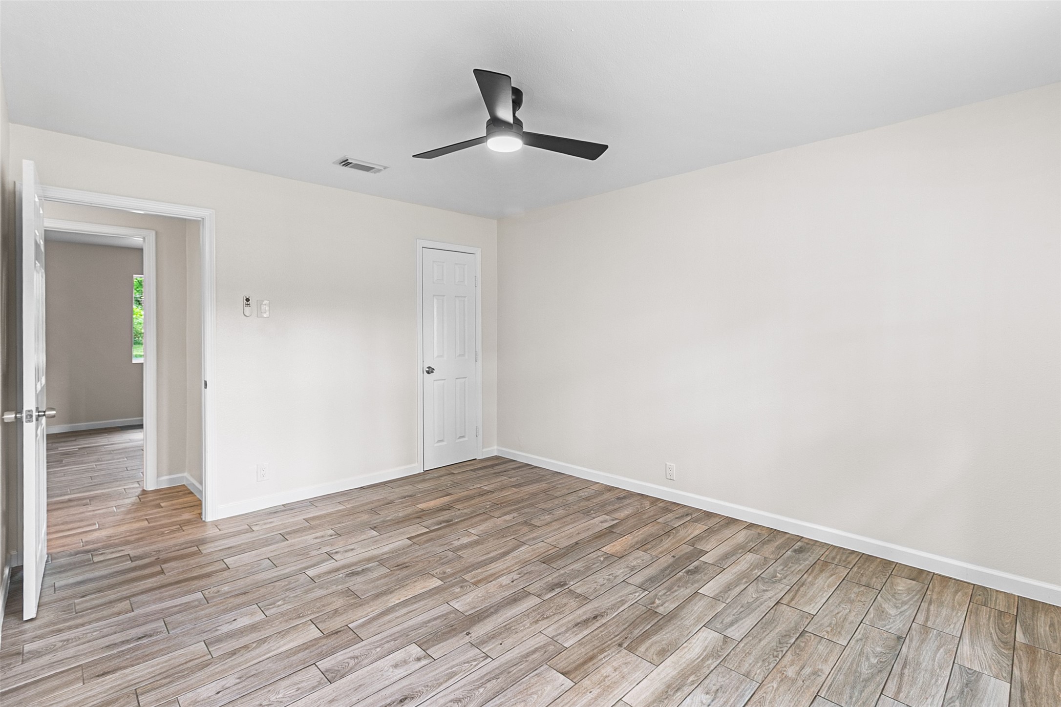 16715 Waycreek Road Houston, TX 77068 - Photo 12 of 41 a view of empty room with wooden floor