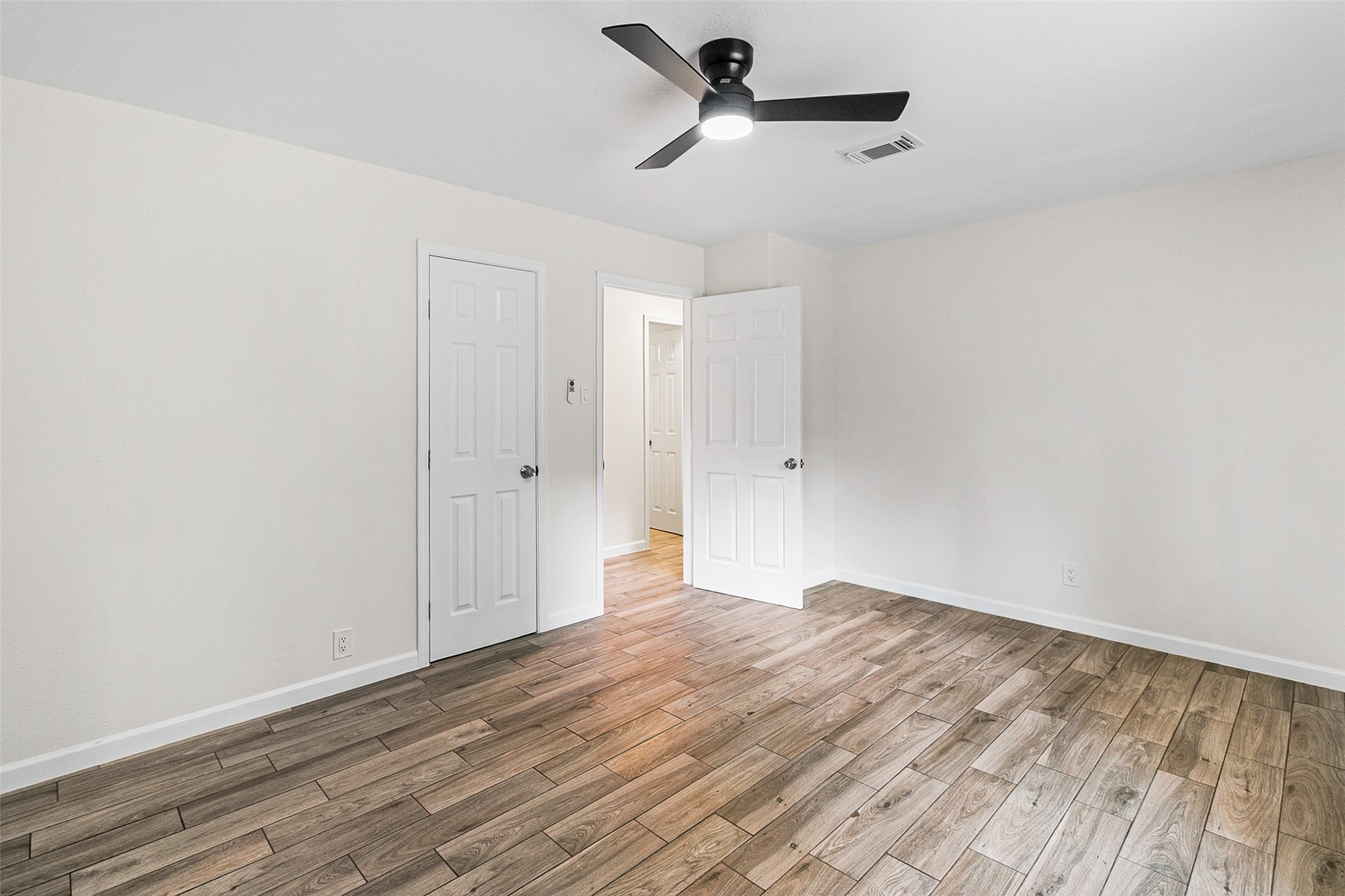 16715 Waycreek Road Houston, TX 77068 - Photo 14 of 41 a view of empty room with wooden floor