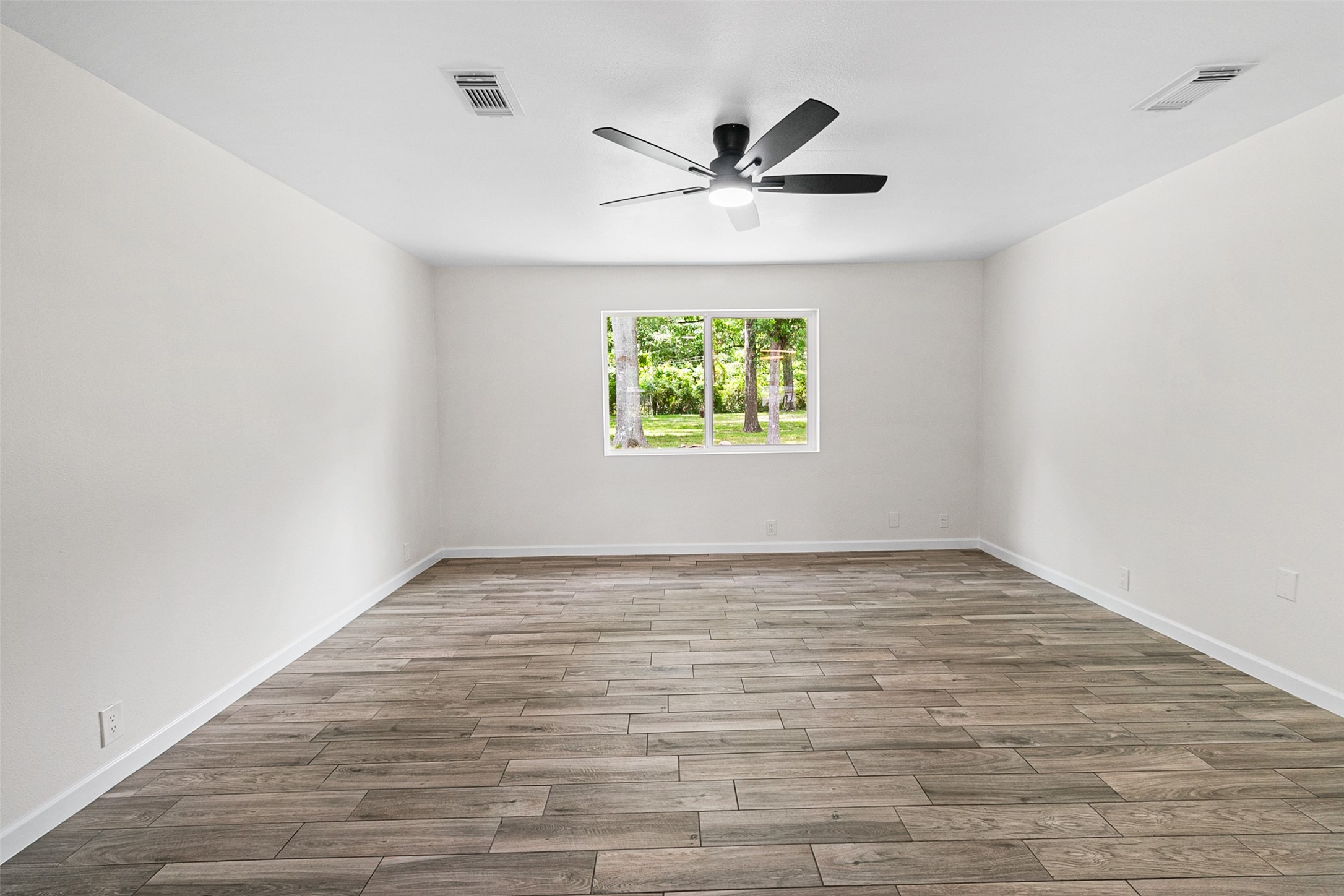 16715 Waycreek Road Houston, TX 77068 - Photo 15 of 41 a view of empty room with wooden floor