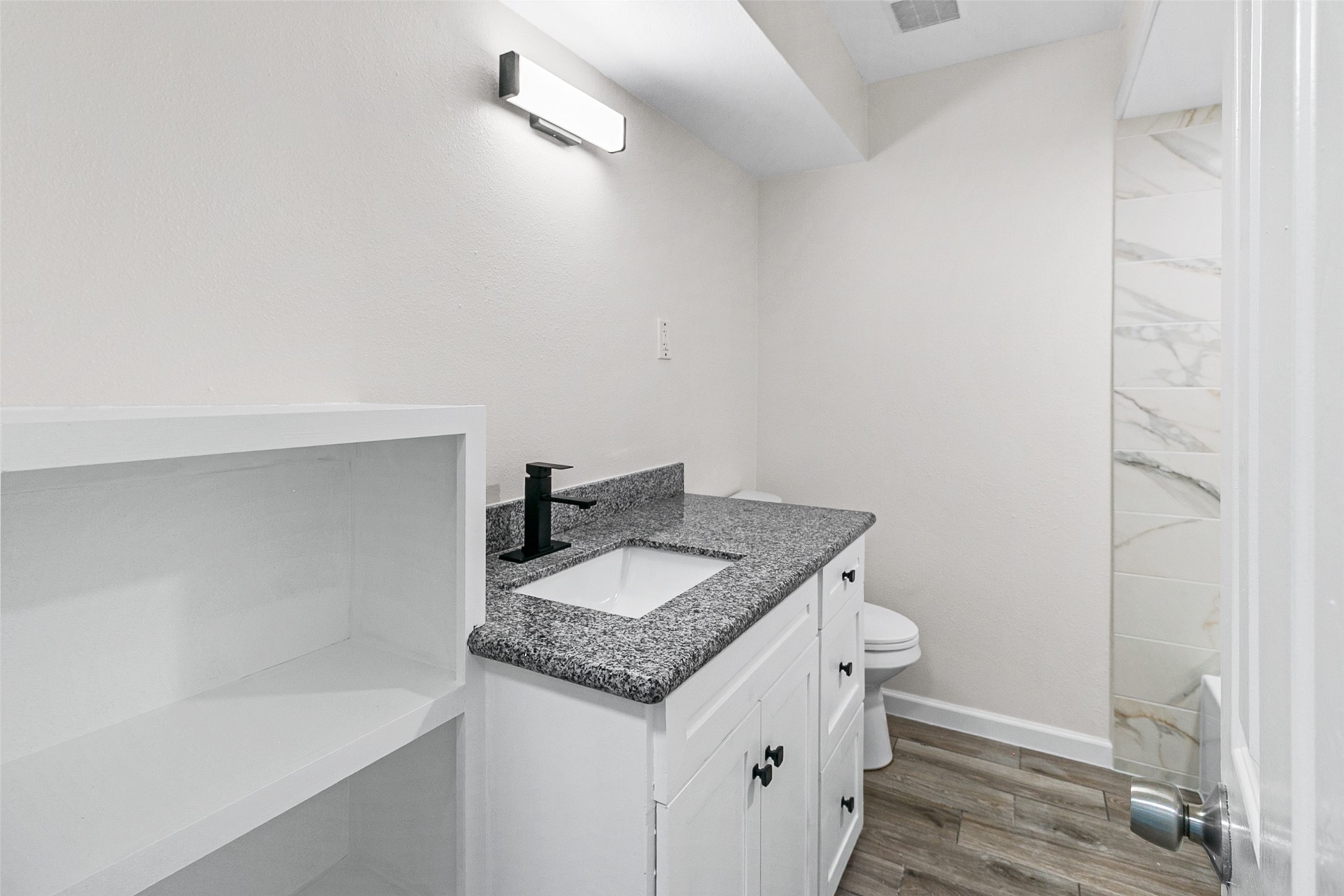 16715 Waycreek Road Houston, TX 77068 - Photo 17 of 41 a bathroom with a granite countertop sink and a mirror