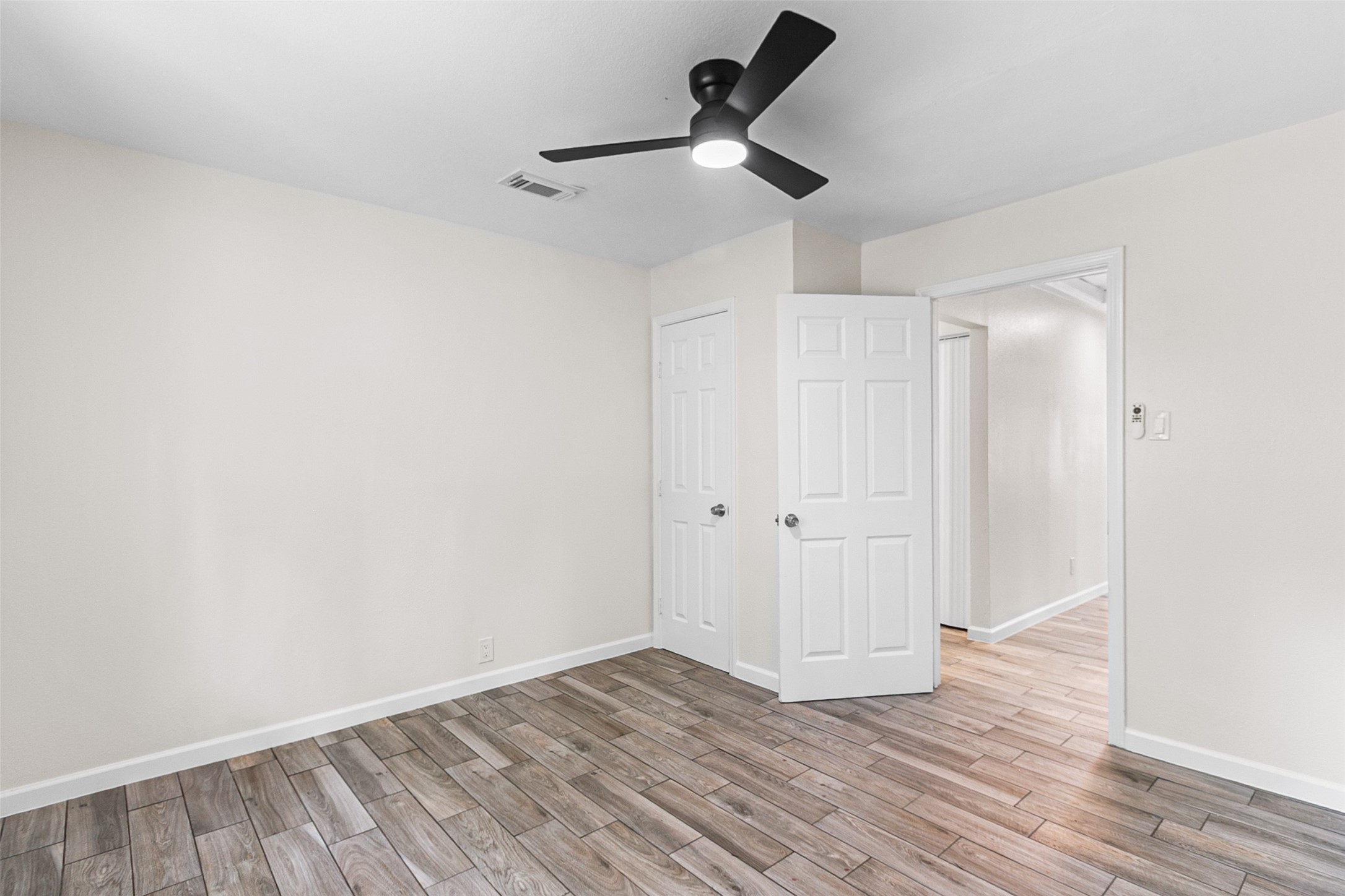 16715 Waycreek Road Houston, TX 77068 - Photo 21 of 41 a view of empty room with wooden floor
