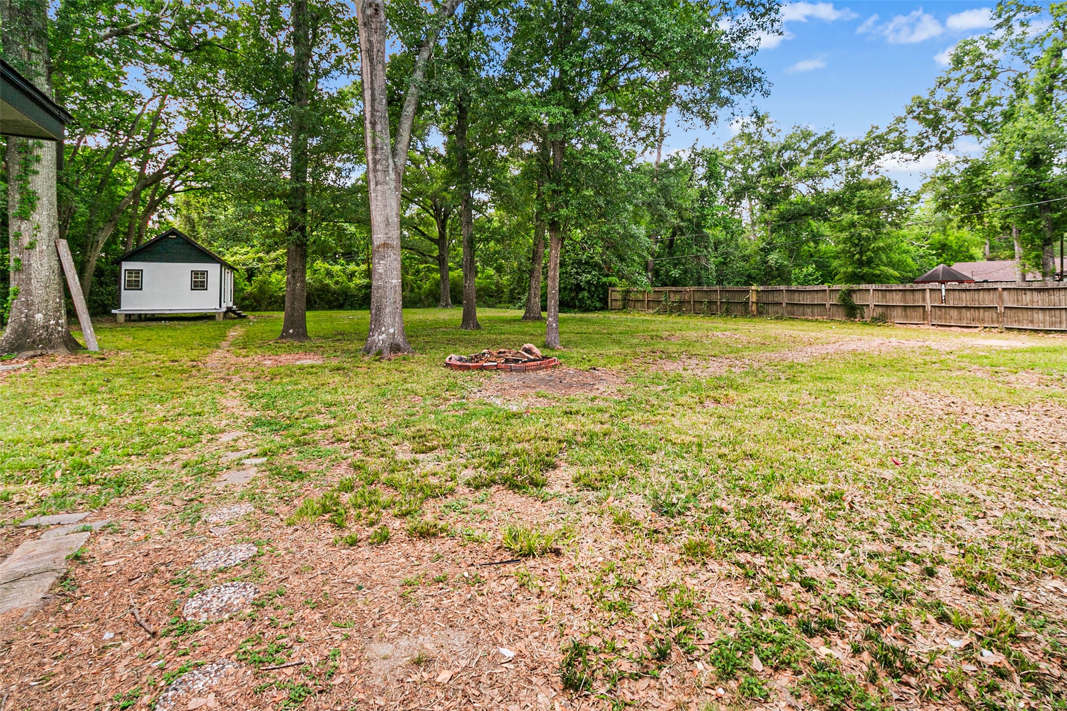 16715 Waycreek Road Houston, TX 77068 - Photo 30 of 41 a view of a tennis ground with large trees