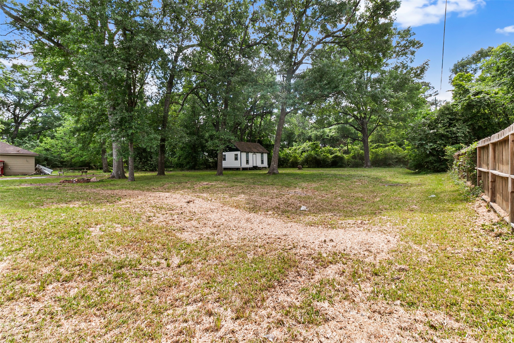 16715 Waycreek Road Houston, TX 77068 - Photo 31 of 41 a view of a yard with a house in the background