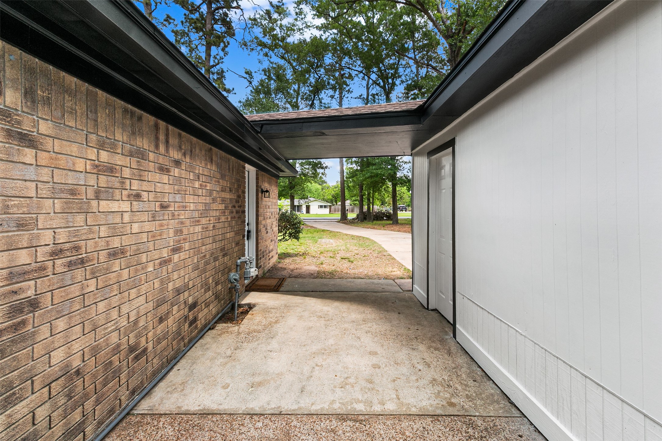 16715 Waycreek Road Houston, TX 77068 - Photo 35 of 41 a view of a pathway both side of the house