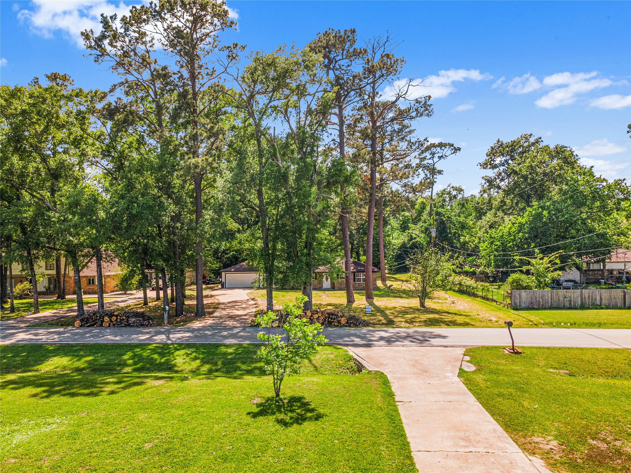16715 Waycreek Road Houston, TX 77068 - Photo 40 of 41 a view of swimming pool with lawn chairs and a fire pit