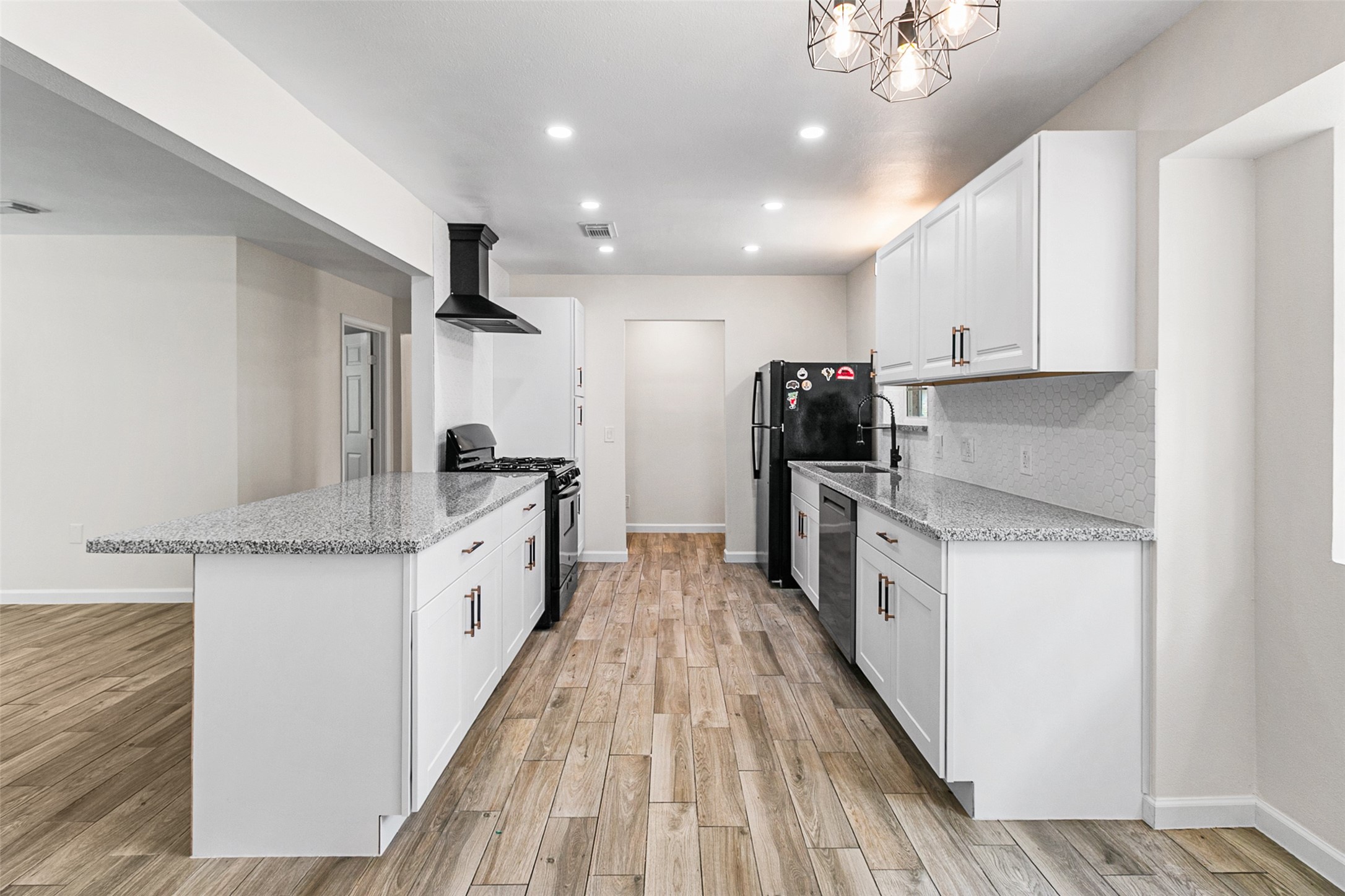 16715 Waycreek Road Houston, TX 77068 - Photo 4 of 41 a kitchen with granite countertop a sink and steel appliances