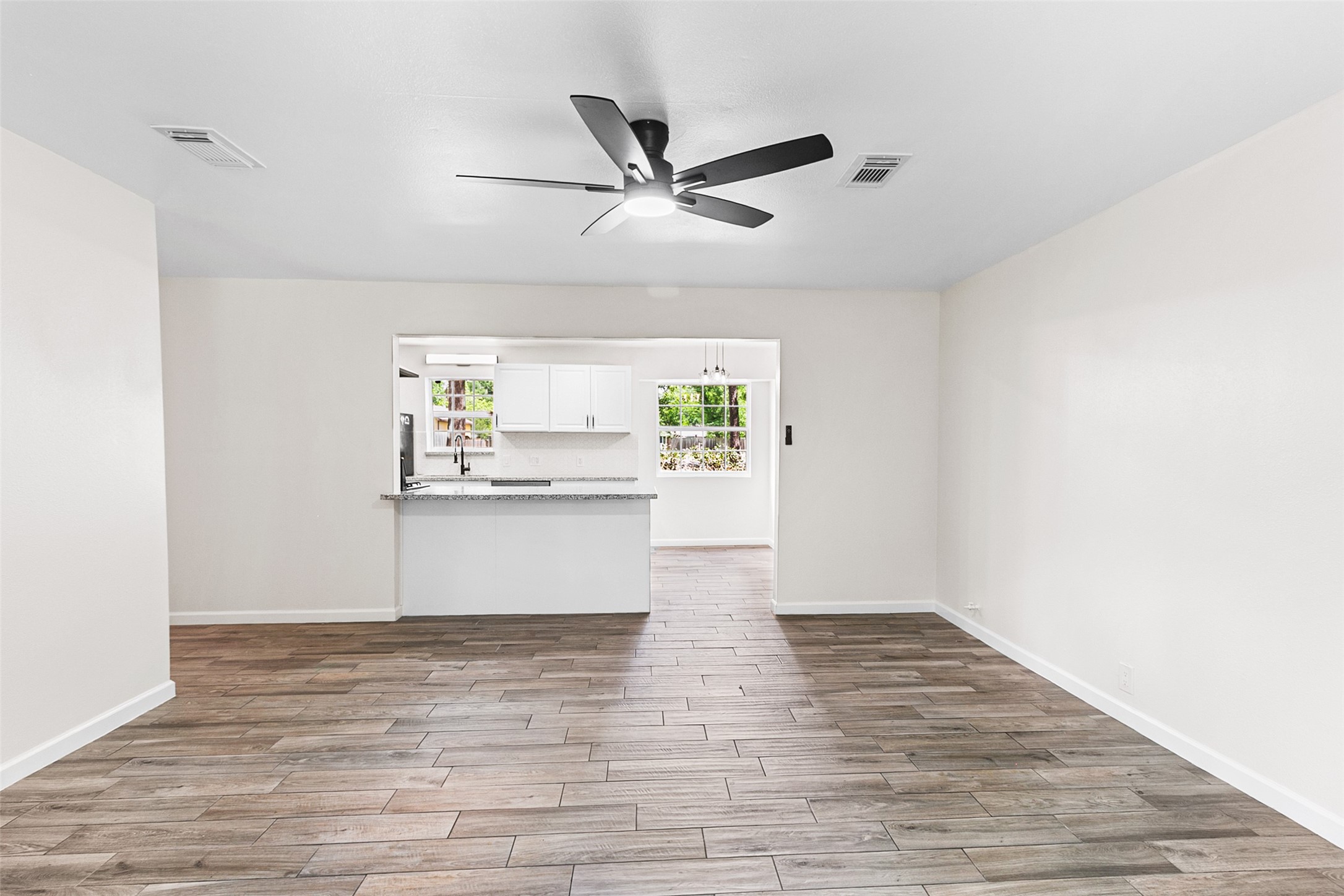 16715 Waycreek Road Houston, TX 77068 - Photo 6 of 41 a view of cabinets with wooden floor