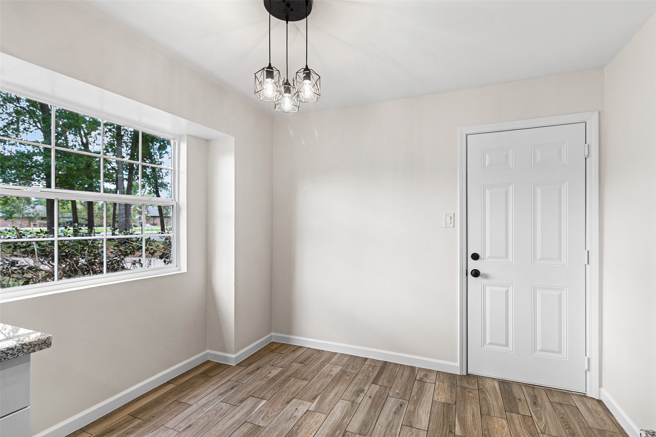 16715 Waycreek Road Houston, TX 77068 - Photo 10 of 41 a view of empty room with window and chandelier fan